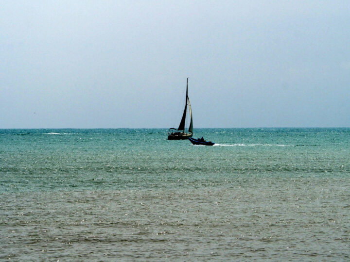Sea sailing yacht and small boat