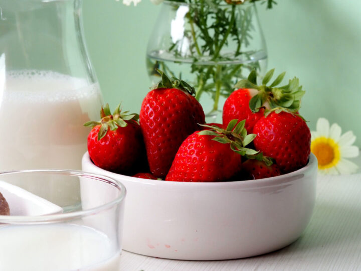 Strawberries and milk jug