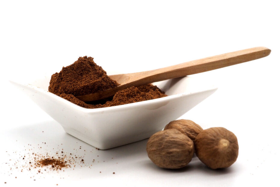 three-whole-walnuts-and-ground-nutmeg-in-a-white-bowl-93